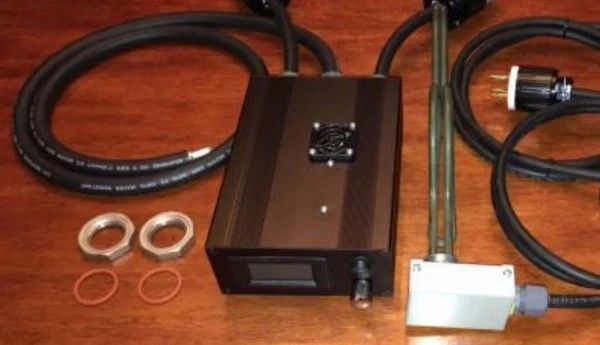 Electronic equipment with wires and accessories on a wooden surface.