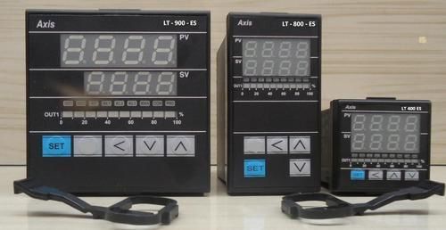 Three Axis LT series temperature controllers of different sizes on a table.
